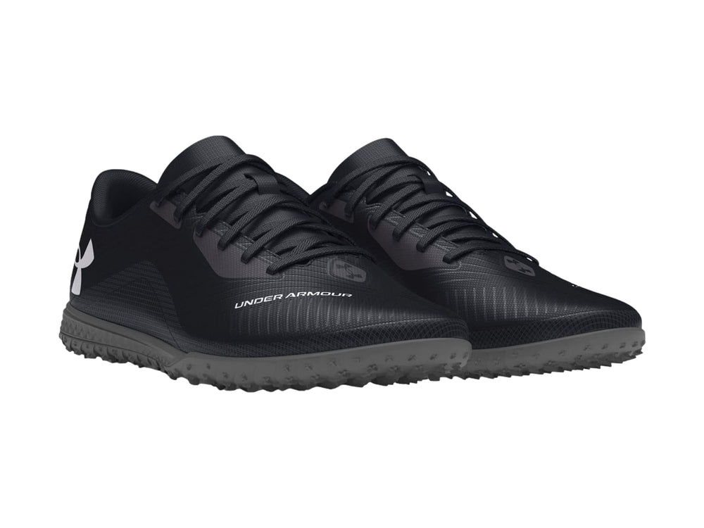 Zapato de fútbol Under Armour Shadow Select Turf color negro con suela para césped sintético.