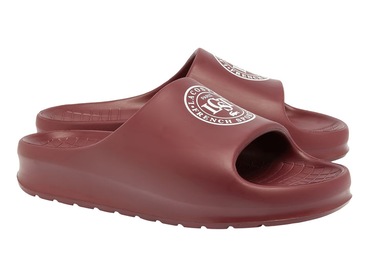 Sandalias tipo slide Lacoste en color burgundy con logo blanco en la banda superior.