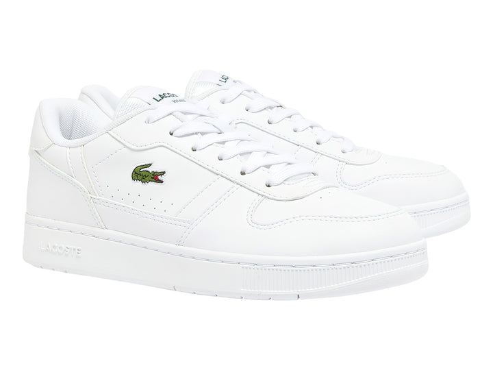 Tenis blancos para niños marca Lacoste con logotipo de cocodrilo verde en el lateral.