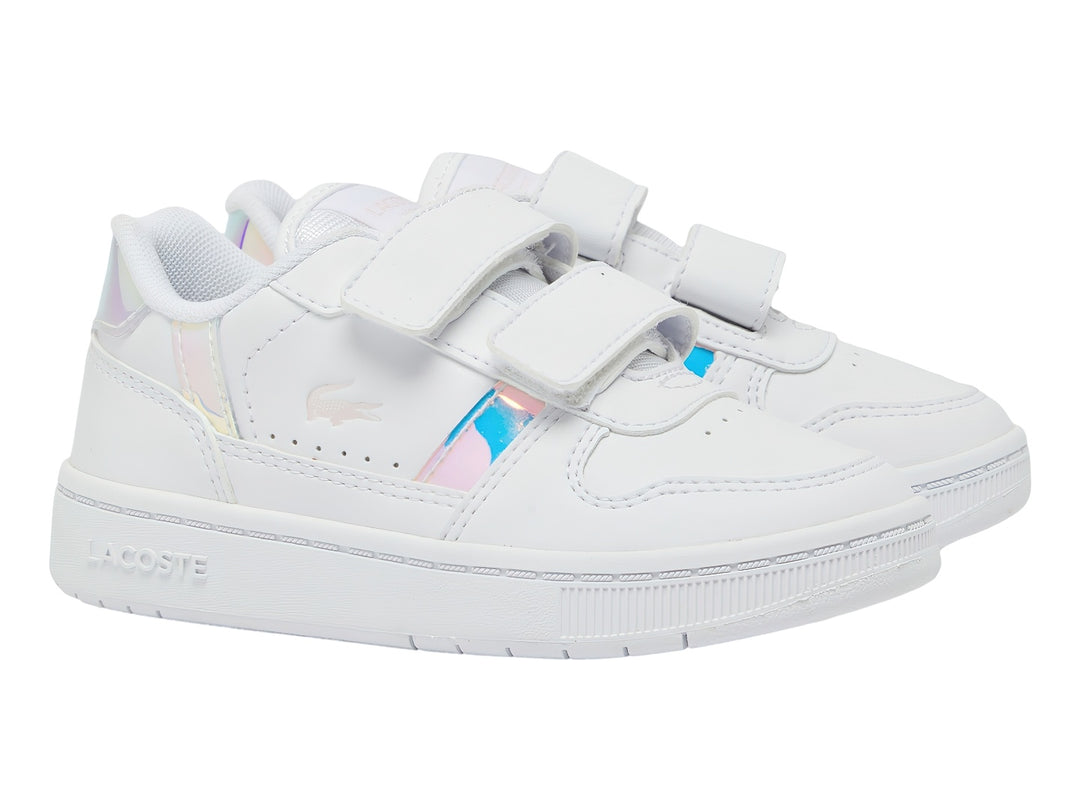 Tenis blancos Lacoste con detalles iridiscentes en rosa y azul y cierre de velcro.