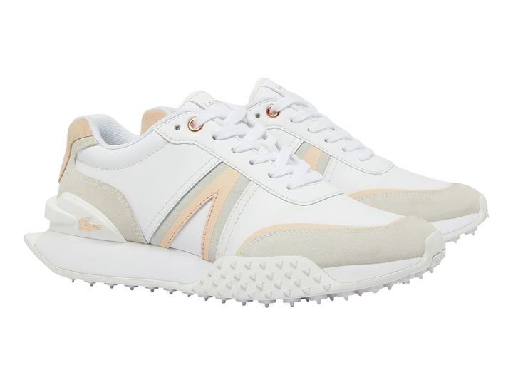 Tenis Lacoste L-Spin Deluxe en color blanco con detalles en rosa claro y beige, diseño deportivo y moderno.