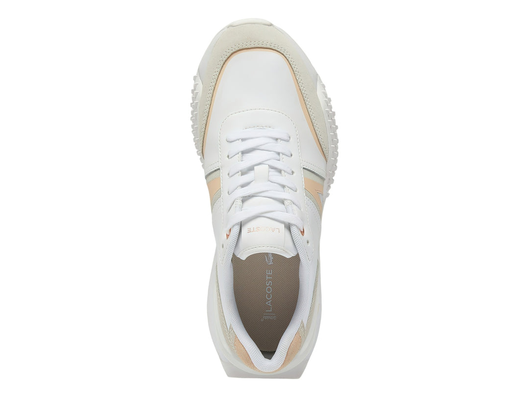 Tenis Lacoste L-Spin Deluxe en color blanco con detalles en rosa claro y beige, diseño deportivo y moderno.