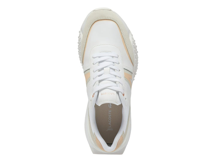 Tenis Lacoste L-Spin Deluxe en color blanco con detalles en rosa claro y beige, diseño deportivo y moderno.