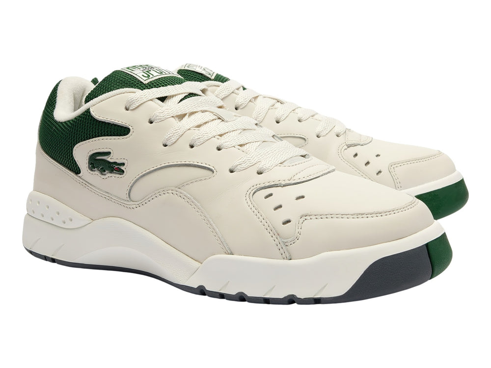 Tenis Lacoste color blanco con detalles en verde oscuro y suela blanca, estilo deportivo casual.
