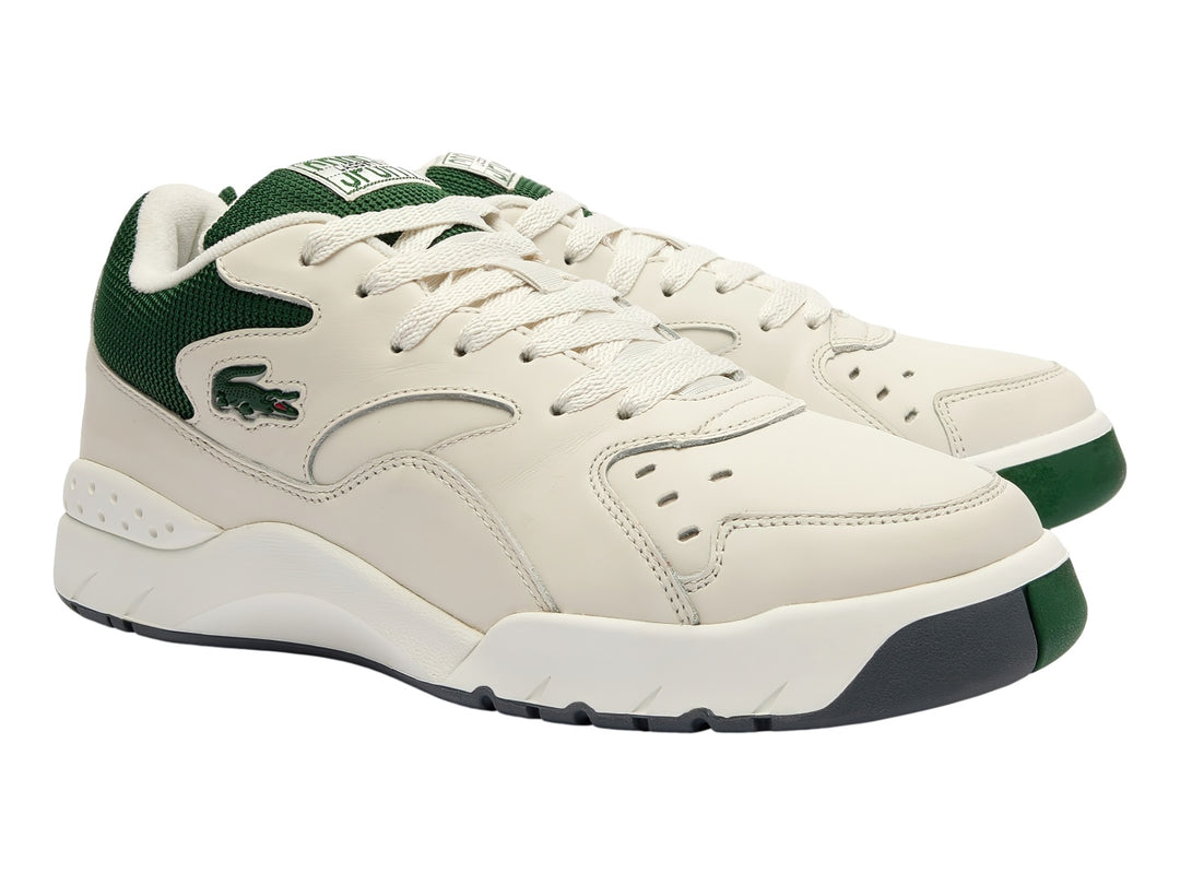 Tenis Lacoste color blanco con detalles en verde oscuro y suela blanca, estilo deportivo casual.