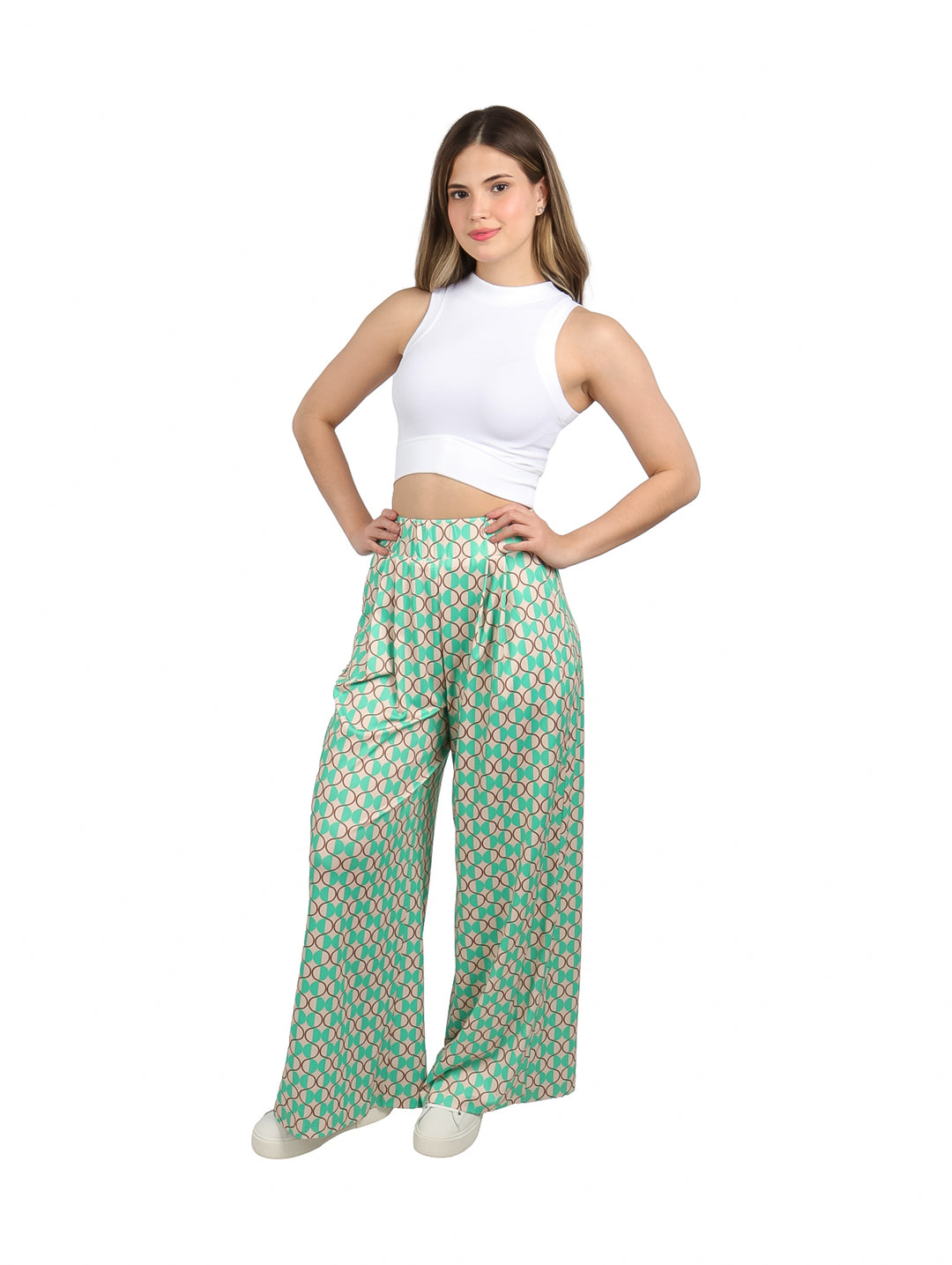 Pantalón palazzo verde con estampado geométrico de círculos en tonos beige y marrón.
