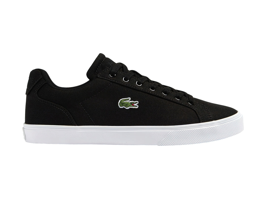 Tenis Lacoste Lerond Pro en color negro con suela blanca y logotipo del cocodrilo en el lateral.