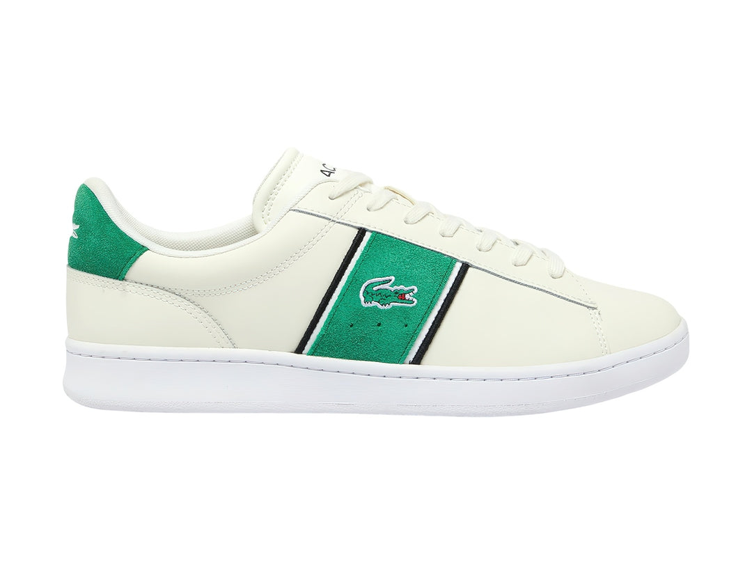 Tenis Lacoste blancos con franja lateral verde y negra y detalle verde en el talón.