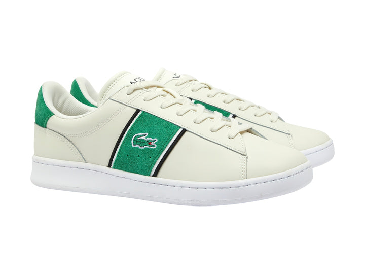 Tenis Lacoste blancos con franja lateral verde y negra y detalle verde en el talón.