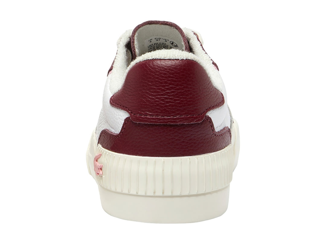 Tenis Lacoste en colores blanco y borgoña con un detalle en rosa y suela blanca.