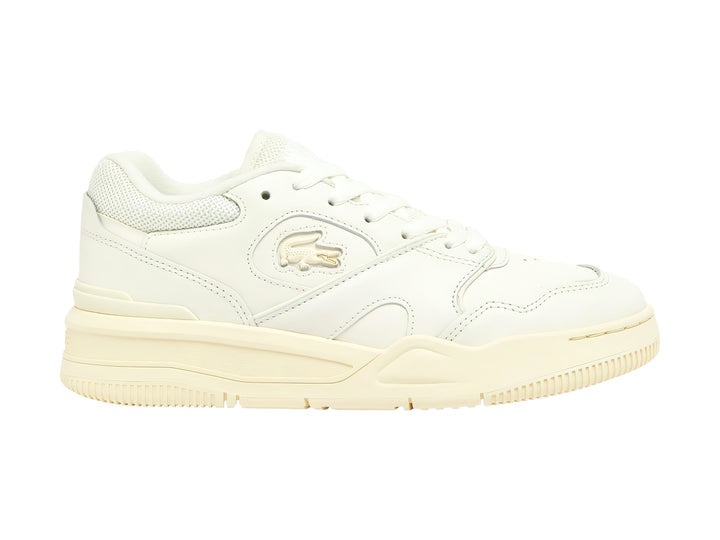 Tenis Lacoste color blanco roto con suela amarillo claro, diseño deportivo y casual.