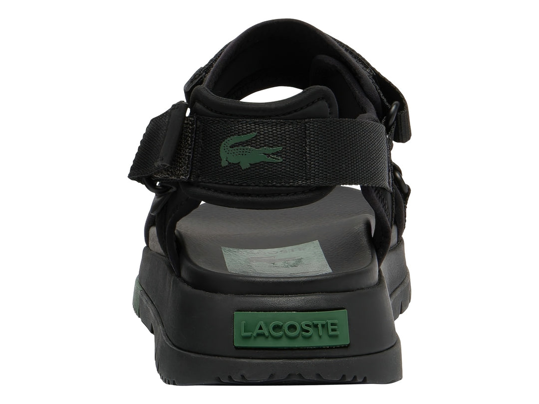 Sandalia negra Lacoste Suruga PRM con suela de plataforma y detalles en verde oscuro.