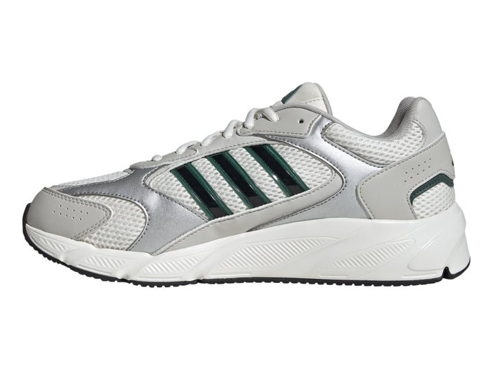 Tenis Adidas Crazychaos 2000 color blanco y plateado con tres franjas verdes y suela blanca.