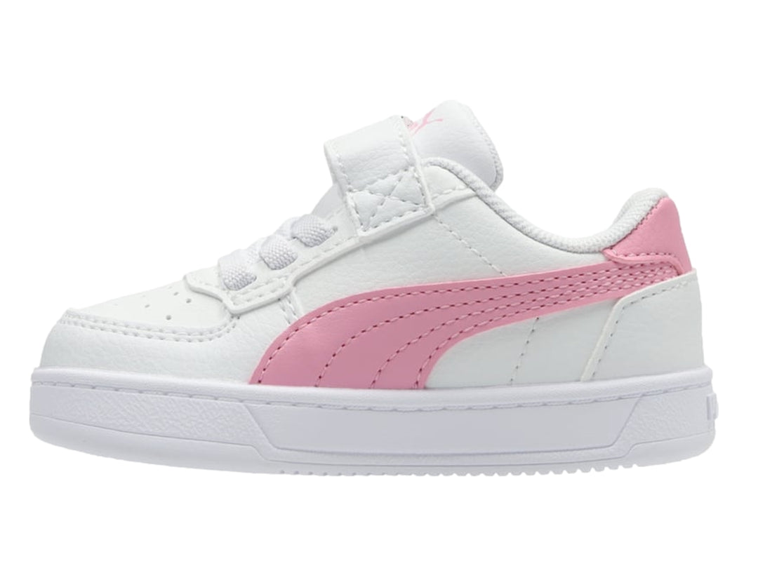 Tenis PUMA blancos con detalles en rosa, cierre de velcro y agujetas para Niño.