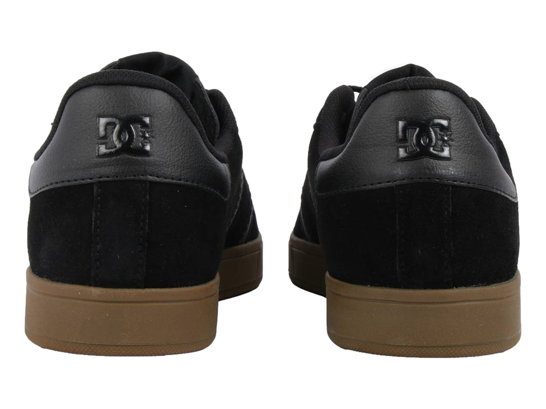Tenis DC Shoes Ollie SD MX color negro con detalles en gris y suela color café.