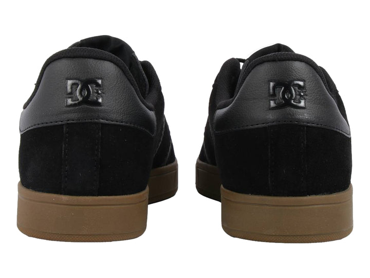Tenis DC Shoes Ollie SD MX color negro con detalles en gris y suela color café.
