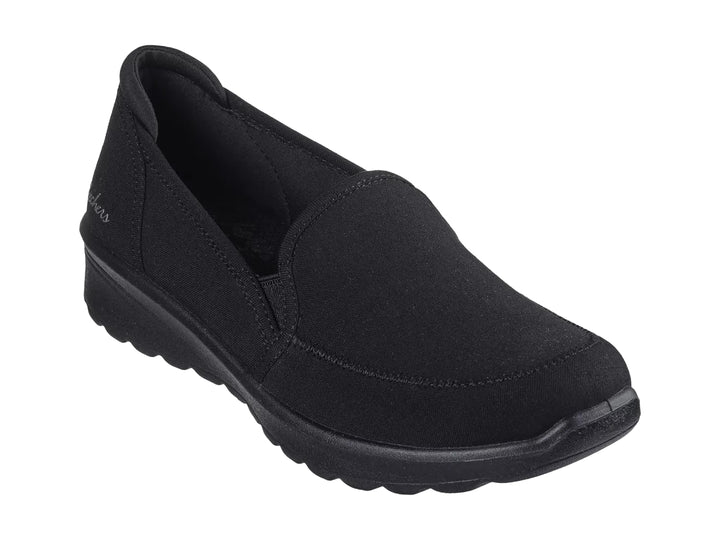 Zapato Skechers Lovely Vibe color negro, estilo slip-on con suela cómoda y acabado mate.