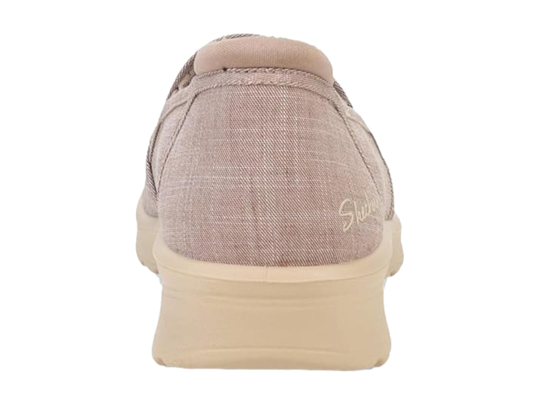 Zapato Skechers modelo Lovely Vibe en color beige, estilo slip-on de tela con suela cómoda.
