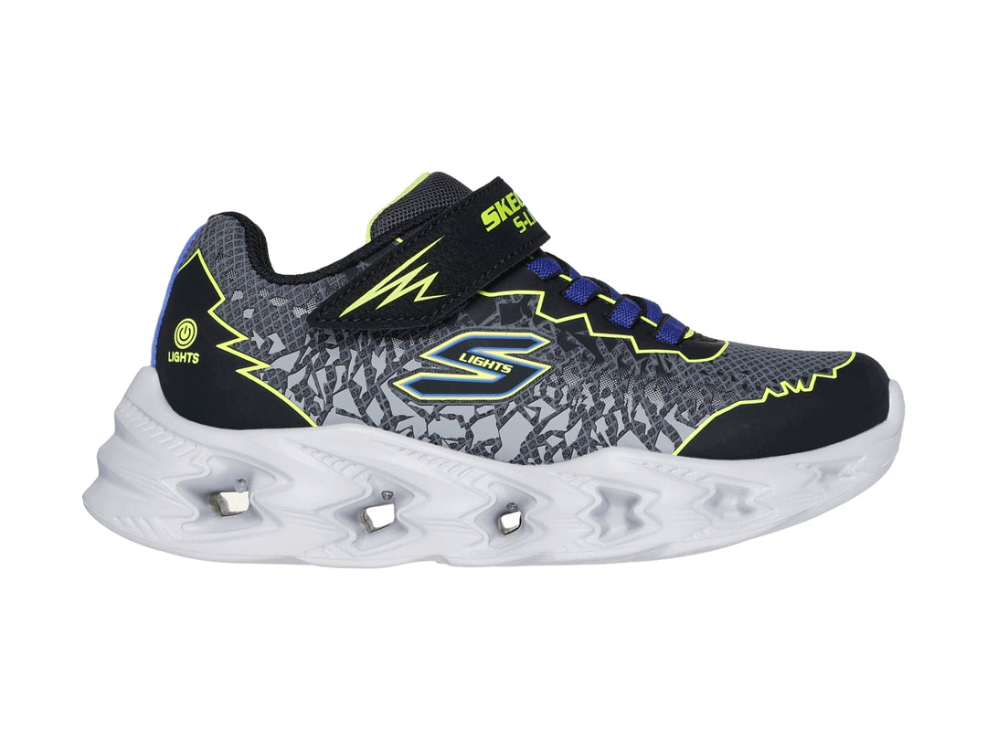 Tenis deportivos Skechers para niño en color negro y amarillo con suela blanca iluminada por luces LED.