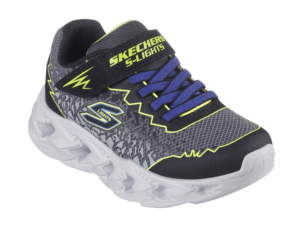 Tenis deportivos Skechers para niño en color negro y amarillo con suela blanca iluminada por luces LED.