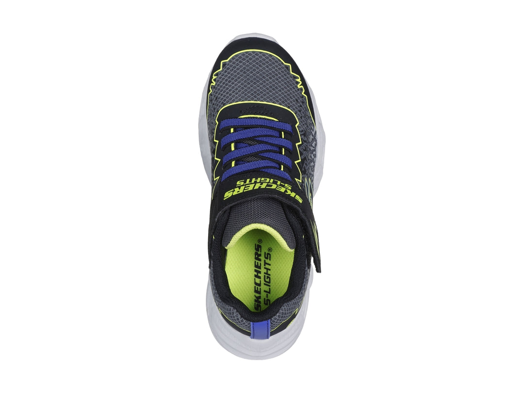 Tenis deportivos Skechers para niño en color negro y amarillo con suela blanca iluminada por luces LED.