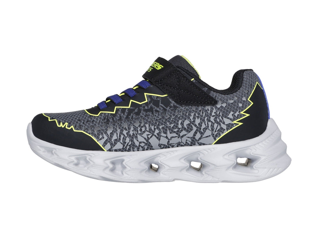 Tenis deportivos Skechers para niño en color negro y amarillo con suela blanca iluminada por luces LED.