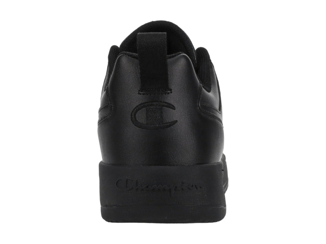 Tenis Champion color negro, diseño de corte bajo con suela gruesa y logo en el lateral.