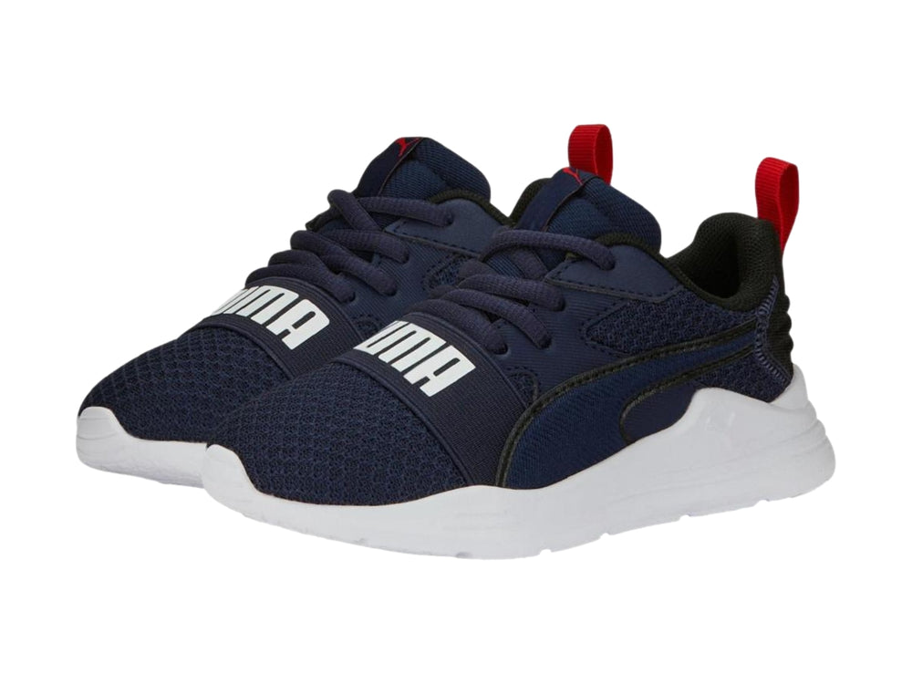 Tenis PUMA Wired Run Pure PS en color azul marino con suela blanca y detalles en rojo.