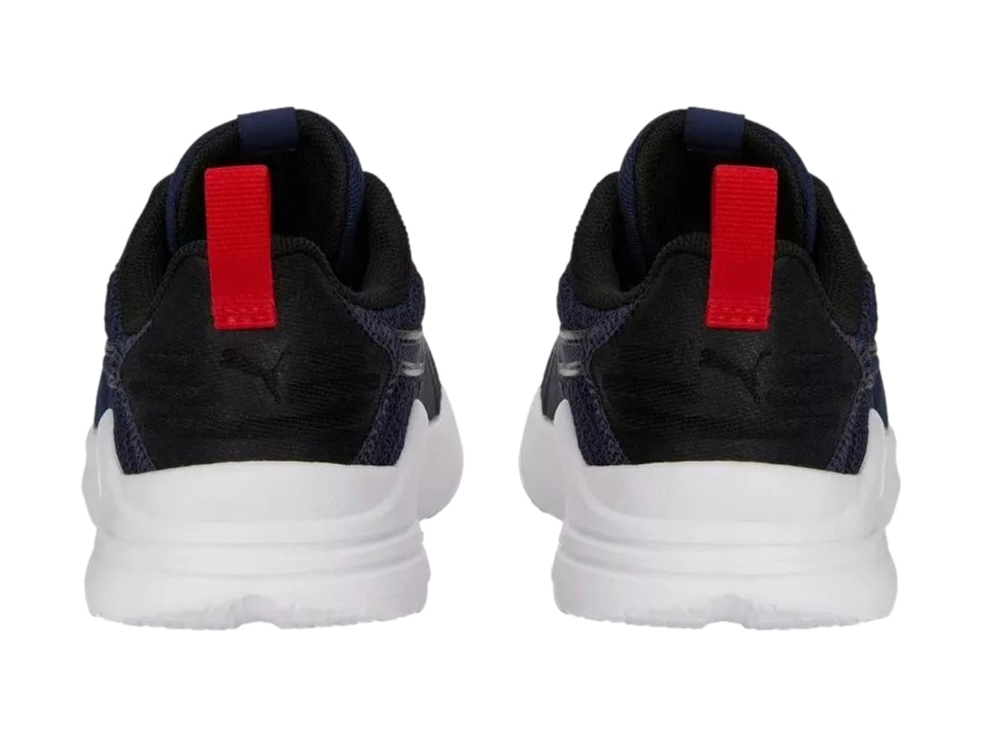 Tenis PUMA Wired Run Pure PS en color azul marino con suela blanca y detalles en rojo.