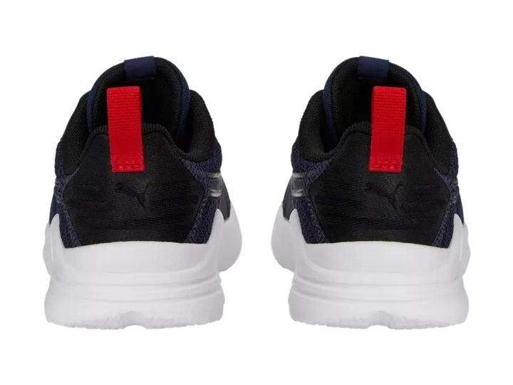 Tenis PUMA Wired Run Pure PS en color azul marino con suela blanca y detalles en rojo.