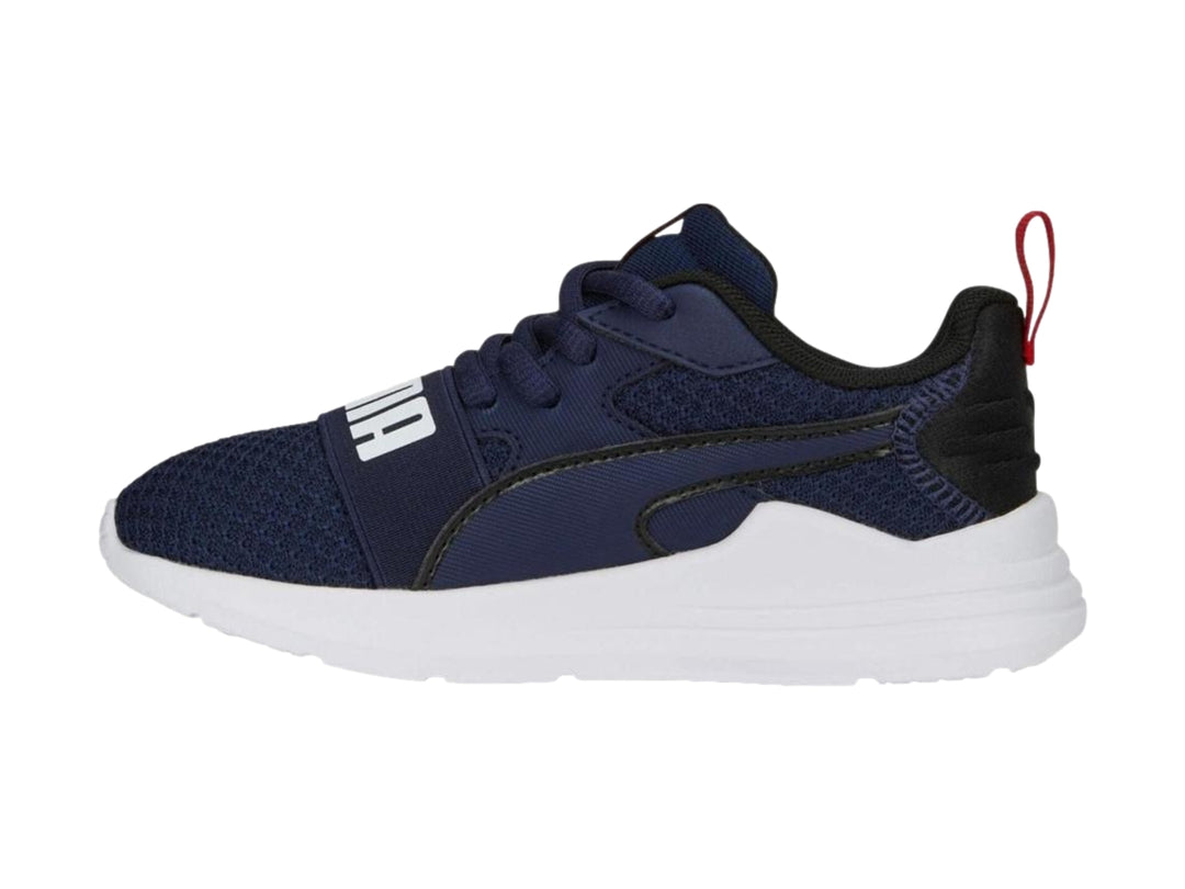 Tenis PUMA Wired Run Pure PS en color azul marino con suela blanca y detalles en rojo.