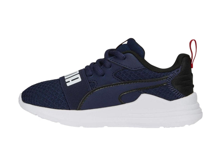 Tenis PUMA Wired Run Pure PS en color azul marino con suela blanca y detalles en rojo.