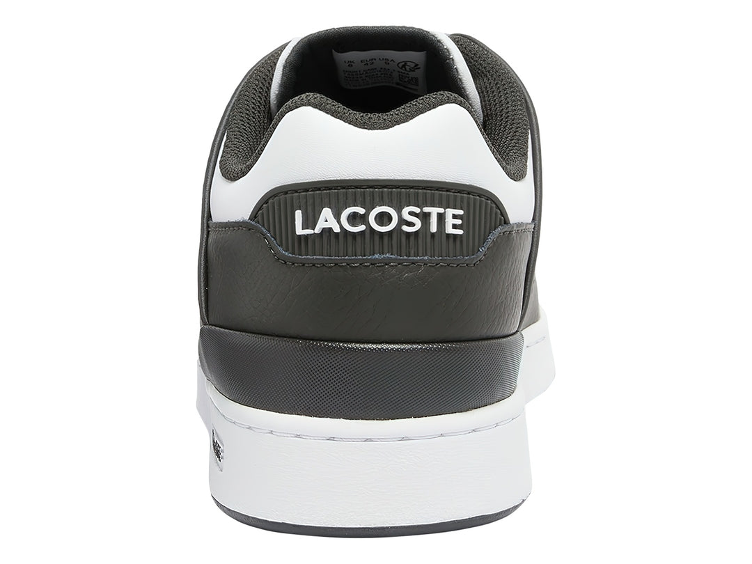 Tenis Lacoste color verde oscuro y blanco con suela blanca y logotipo del cocodrilo en el lateral.