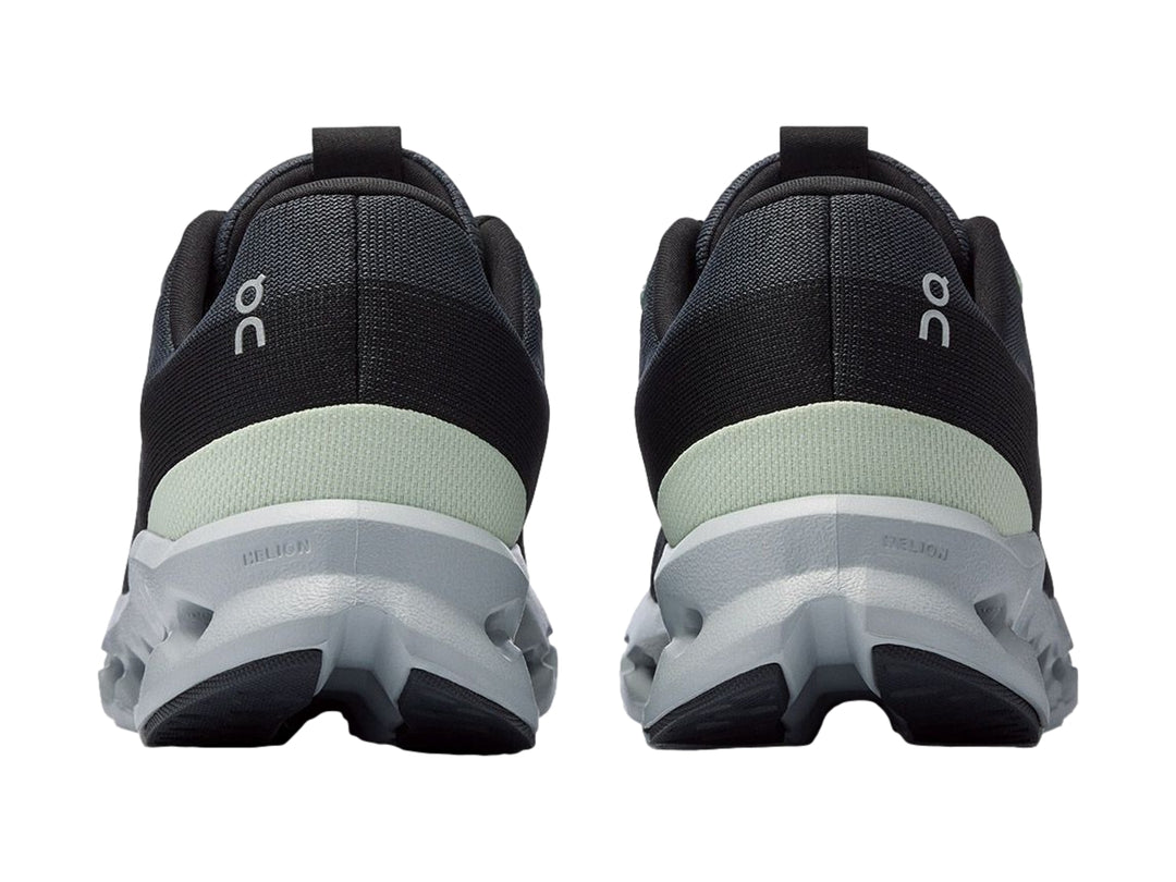 Tenis deportivos On Cloud color gris oscuro con suela gris claro y detalles en verde menta.