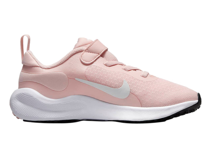 Tenis deportivos Nike Revolution 7 color rosa con suela blanca y correa de velcro.