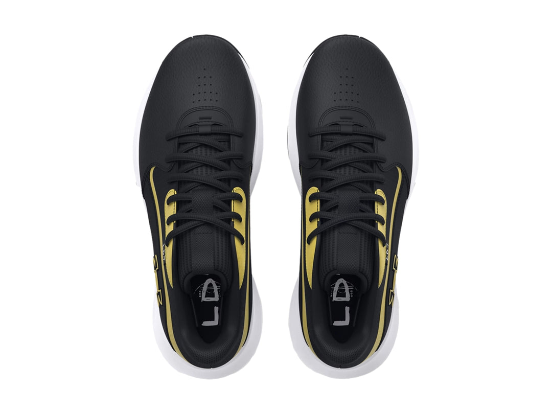 Tenis de baloncesto Under Armour Lockdown 7 en color negro con detalles dorados y suela blanca.