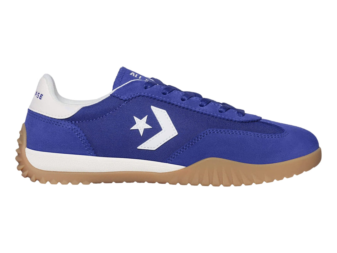 Tenis Converse Run Star Trainer en color azul noche con suela café y detalles en blanco.