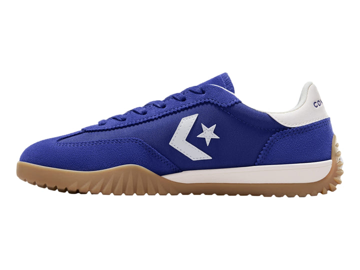 Tenis Converse Run Star Trainer en color azul noche con suela café y detalles en blanco.