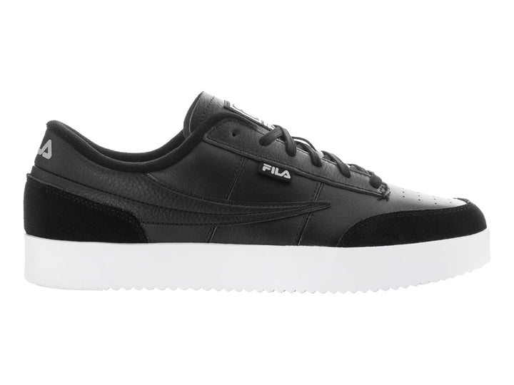 Tenis FILA Royalton en color negro con suela blanca y detalles en gamuza sintética.