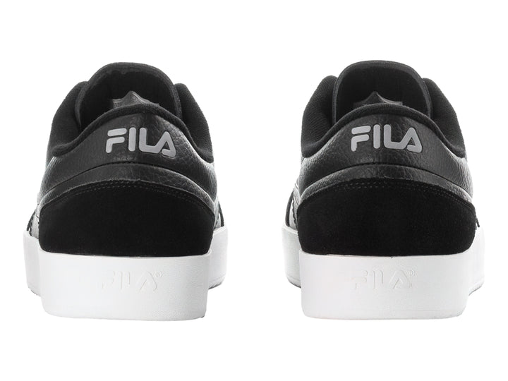 Tenis FILA Royalton en color negro con suela blanca y detalles en gamuza sintética.