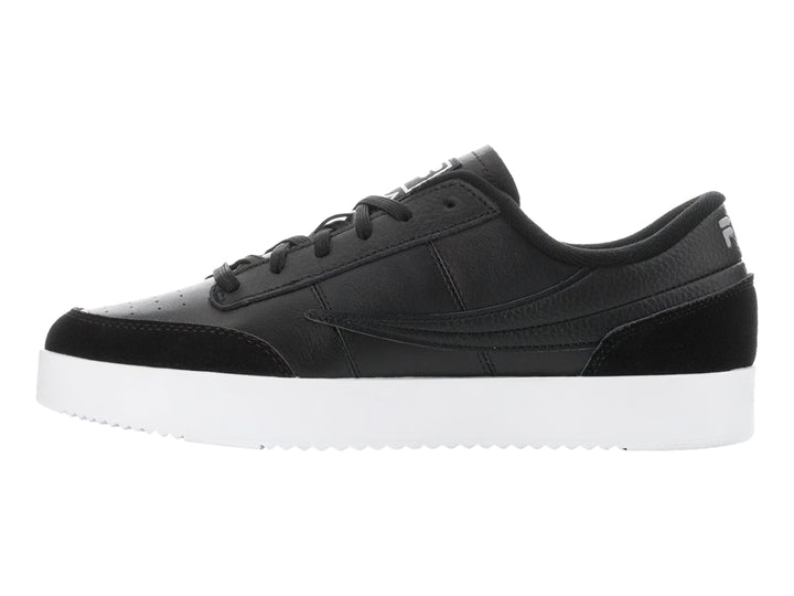 Tenis FILA Royalton en color negro con suela blanca y detalles en gamuza sintética.