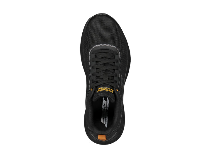 Tenis deportivos Skechers color negro con detalles en naranja y suela negra texturizada.