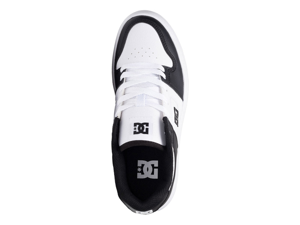 Tenis DC Shoes de plataforma en colores blanco y negro con suela gruesa blanca.