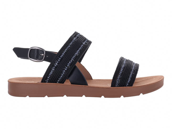 Sandalia plana color negro con detalles brillantes y suela color café.