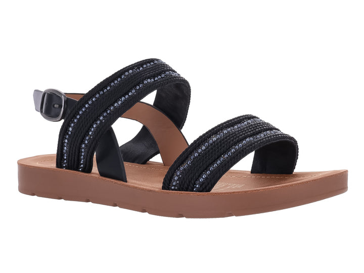 Sandalia plana color negro con detalles brillantes y suela color café.