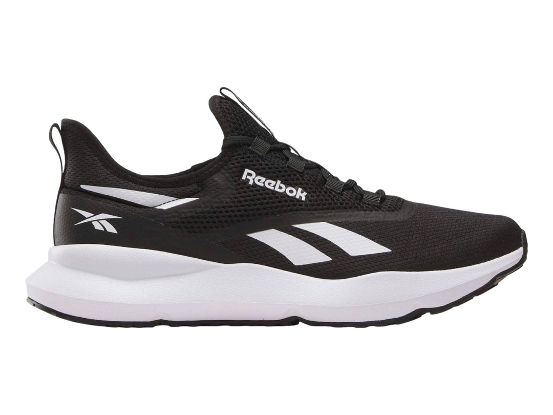 Tenis deportivos Reebok color negro con suela blanca y detalles laterales en blanco.