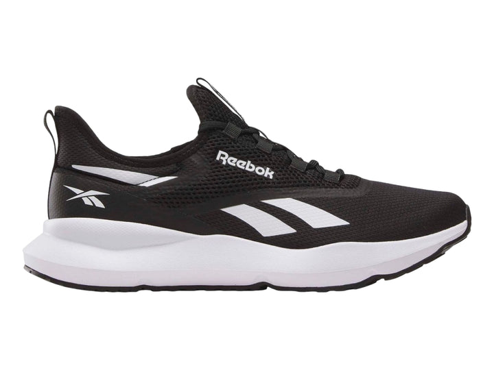 Tenis deportivos Reebok color negro con suela blanca y detalles laterales en blanco.