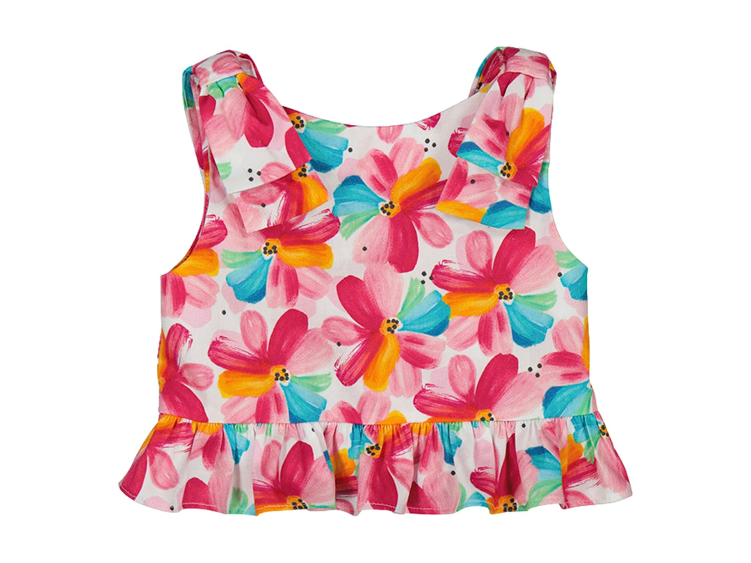 Top peplum para niña color magenta con estampado floral multicolor y detalles de volantes.
