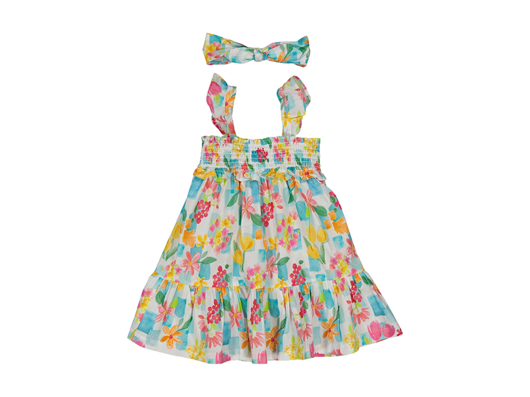 Vestido infantil multicolor con estampado floral y diadema a juego sobre fondo blanco.