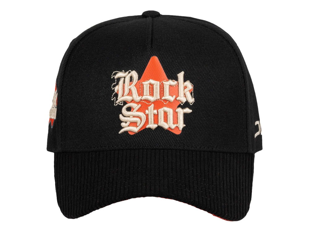 Gorra snapback color negro con bordado 'Rock Star' en el frente y logo JC lateral.
